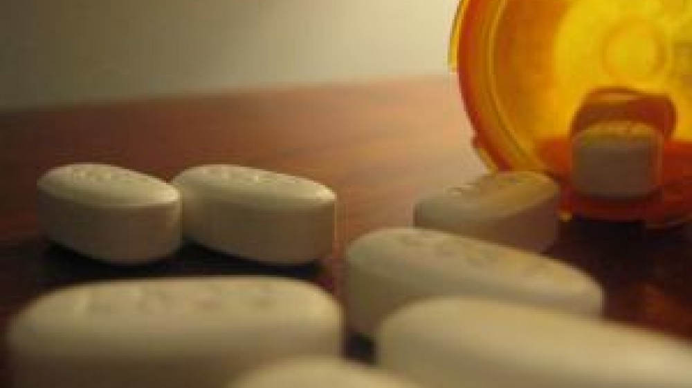 Tablets on a table coming out the bottle