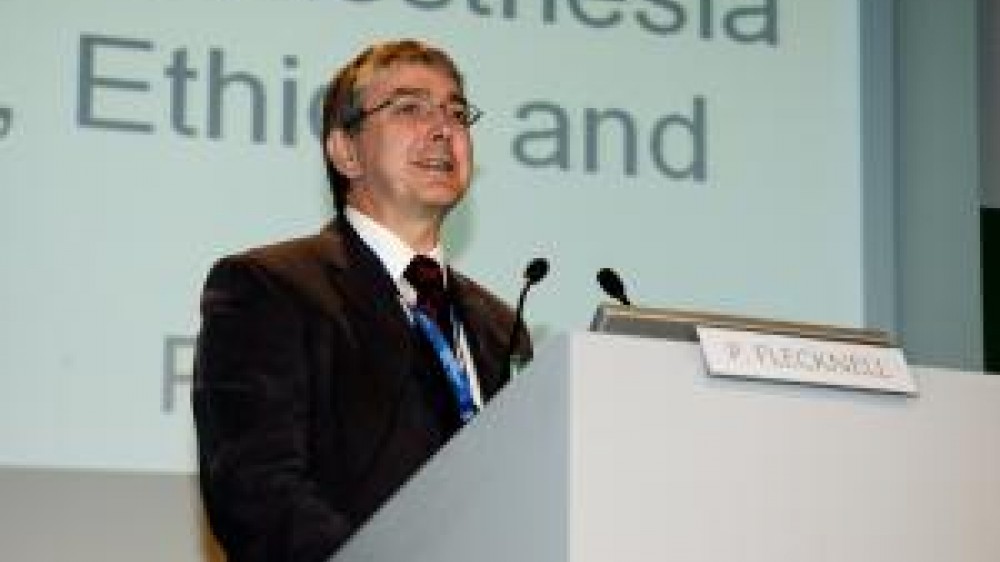 Professor Paul Flecknell giving a speech on a podium