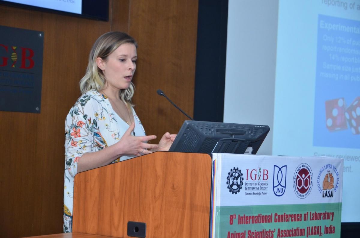 A female on the podium giving a presentation 