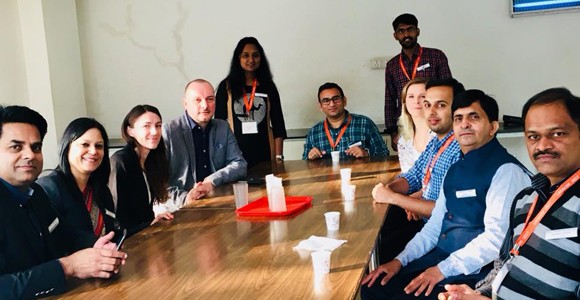 NC3Rs team in India with fellow colleagues sitting around a table