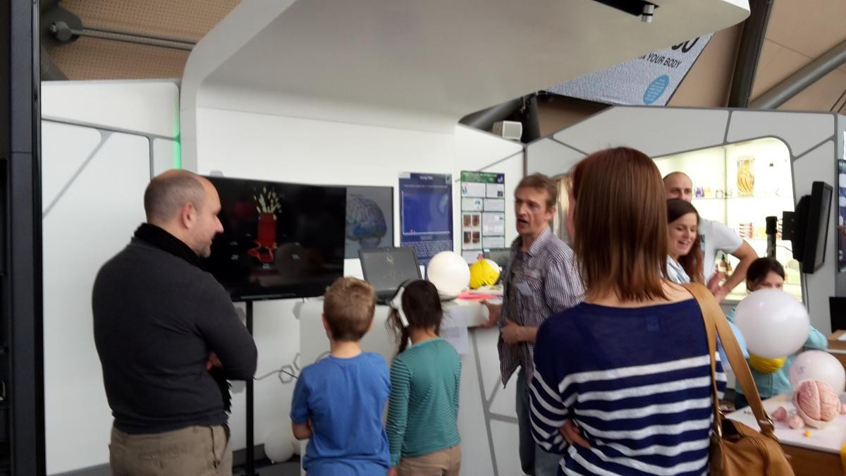 Two children and three adults in conversation at the learning about the 3Rs: science fun for all ages engagement 