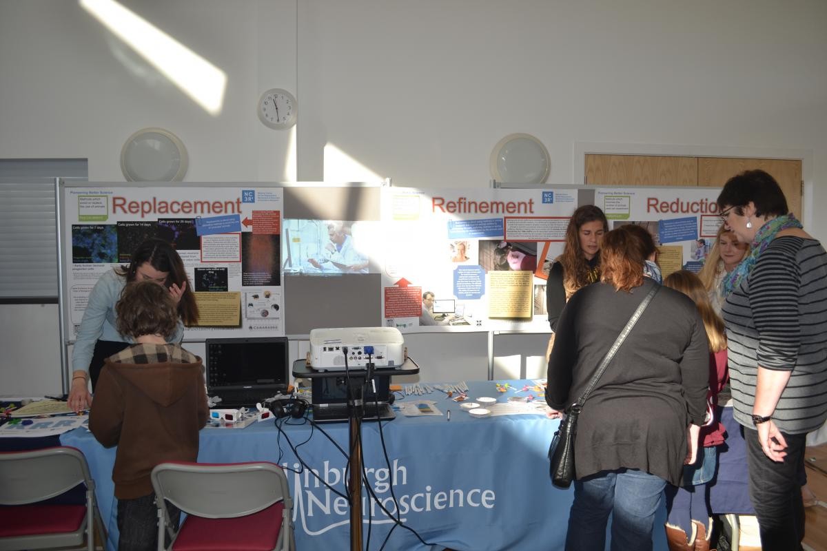 The NC3Rs exhibition stand with attendees by the stand