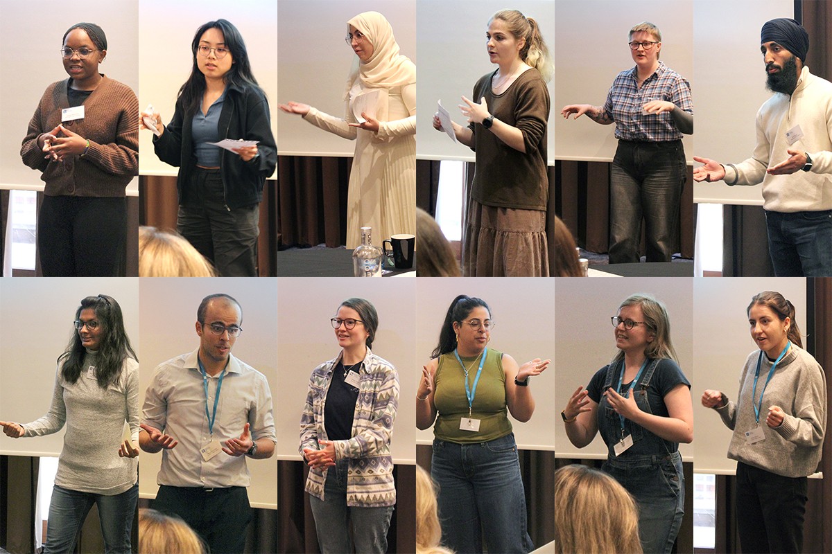 12 PhD students giving one-minute elevator pitch presentations