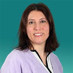Smiling woman with shoulder length dark hair