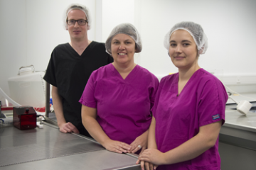 Dr Claire Gibson with two colleagues beside her on the left and right