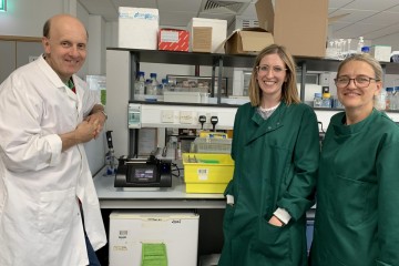 Professor John Greenman on the left with two colleagues on the right in a laboratory