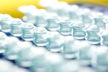 Rows of PCR tubes on a yellow background